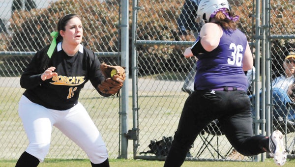 Opp’s Laura Kate Young makes the out at first base during the Lady Bobcats’ 14-1 victory over Pike County Saturday. The Lady Bobcats were led by freshman pitcher Katlynn Schively, who gave up no runs in 15 innings. | Andrew Garner/Star-News