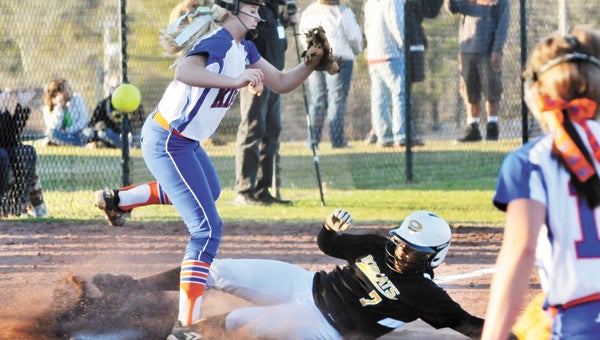 Opp’s Octavia Thompson (7) slides safely into third base during the third inning Tuesday night. The Lady Bobcats beat Kinston 4-1. |                                                                                                             Andrew Garner/Star-News