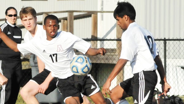Andalusia’s Ashton Evans (17) advances as teammate Hiten Patel (12) brings the ball forward. Will Parker (background) assists.                            Andrew Garner/Star-News