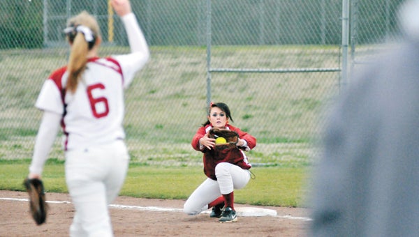 Andalusia pitcher Maggie Lambert (6) throws a runner out at first as Olivia Dixon (background) completes the out Friday night. |                                                                                                                    Andrew Garner/Star-News