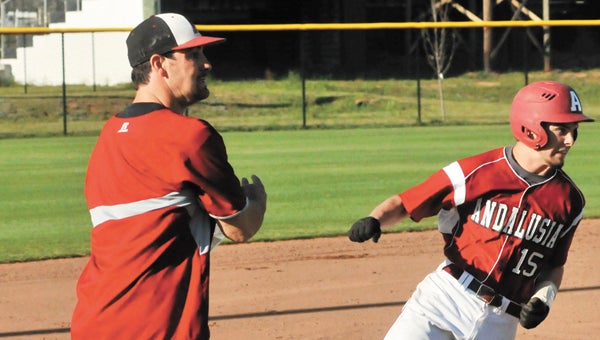 Andalusia coach Jonathan Rasberry (left) said he’s excited about what the team has accomplished so far this season. Here, he coaches Hunter Earnest going around third base in an earlier game this season. |                        Andrew Garner/Star-News