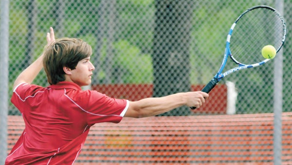 Andalusia’s Brandon Scruggs returns a backhand during an earlier match this season. The boys and girls tennis teams will play at state next week. | Andrew Garner/Star-News