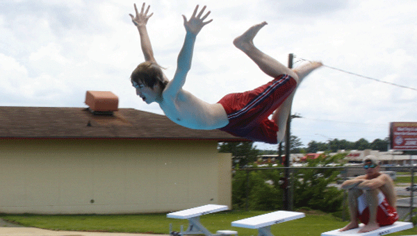 Dustin Baker shows off his diving board skills.