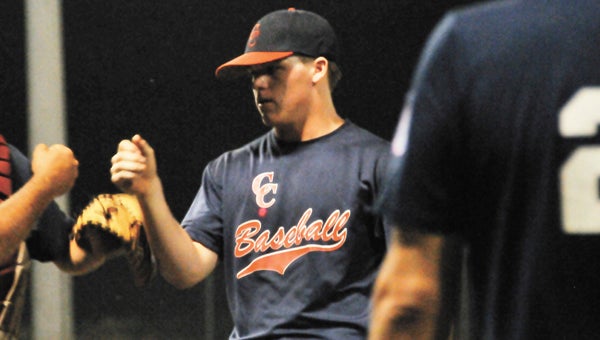Covington County pitcher Quinton Maddox gets a fist-bump from coach Eddie Stacey after throwing a good inning during Tuesday night’s second game. | Andrew Garner/Star-News