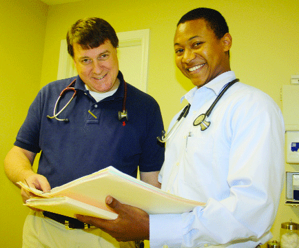 Dr. Mike Stanfield of Opp participates in the Alabama Medical Consortium, and here, he discusses a patient with the soon-to-be-doctor, Justin Freeney of Dozier. 