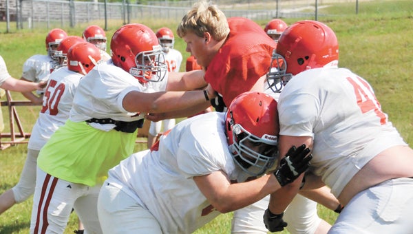 Pleasant Home linemen participate in spring drills earlier in May. The Eagles will partake in their second midnight practice, starting at 12 a.m. Monday. | File photo