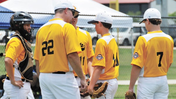 Opp coach Robbie Ross (22) talks to Tylur Schively (11) during an earlier game this season. The Bobcats fought hard in their 7-1 loss to Kingsbridge, N.Y. Friday at the 2013 Cal Ripken 12U Baseball World Series in Hammond, Ind. |          File photo