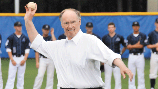 Gov. Robert Bentley throws out the ceremonial first pitch to open the Babe Ruth W0rld Series here Thursday night.