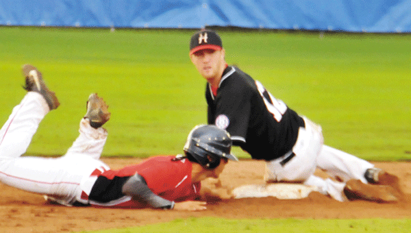 Covington County’s Will Harrison, also an Andalusia football player, tries for second base Friday night. 