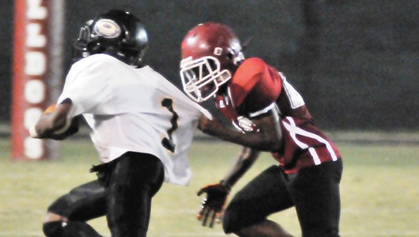 Andalusia’s Cameo Stoudemire (right) makes a tackle Thursday night. |                                 Andrew Garner/Star-News