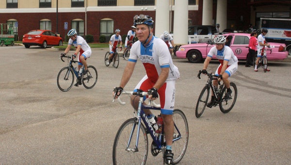 members of the Wings Cancer Foundation bike team take off from Andalusia’s Holiday Inn Express. 
