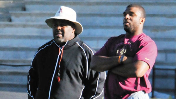 Kansas City Chiefs linebacker Nico Johnson (right) watches practice at Andalusia with former defensive coach, Marshall Locke Tuesday. | Andrew Garner/Star-News