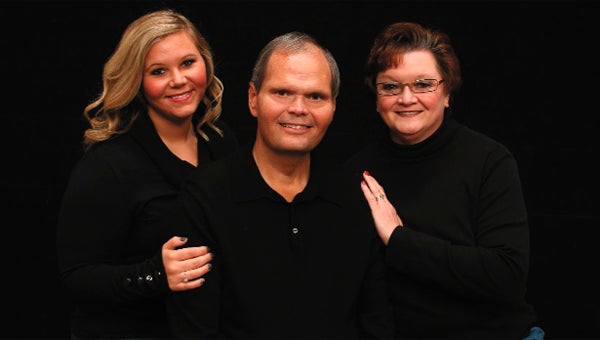 Pike, pictured with his daughter Kristen, left, and wife Kim, passed away this week after a long battle with cancer.  