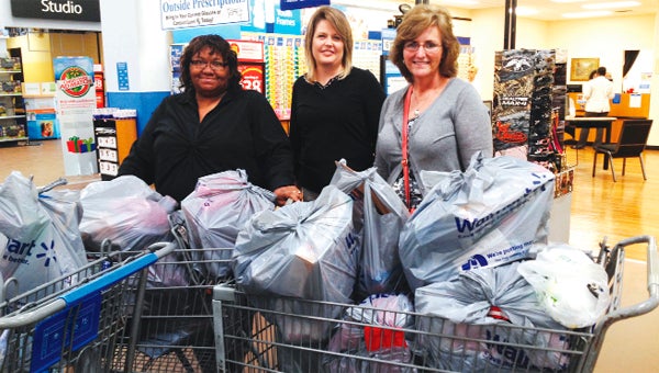 PowerSouth employees shop for Christmas toys.