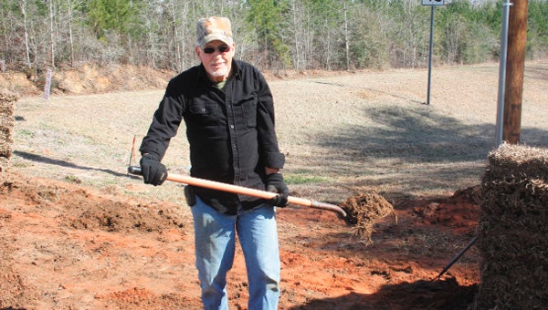 Wayland Hamm prepares the ground for sod at the latest Habitat for Humanity home.