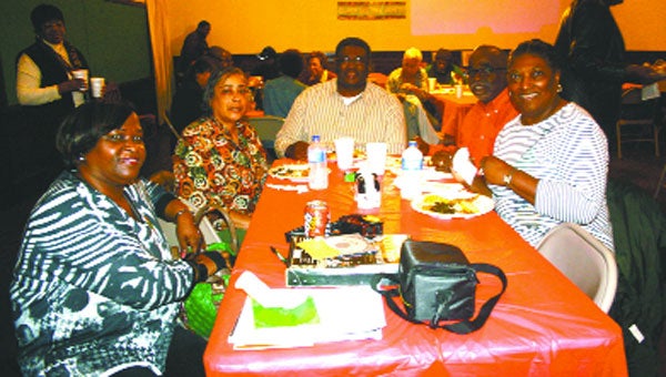 From left, Brinda Sheridan, Joyce Belcher, Nathaniel Belcher, Jerry Smith and Lena Boswell enjoy the meal Saturday at the River Falls Community Center.