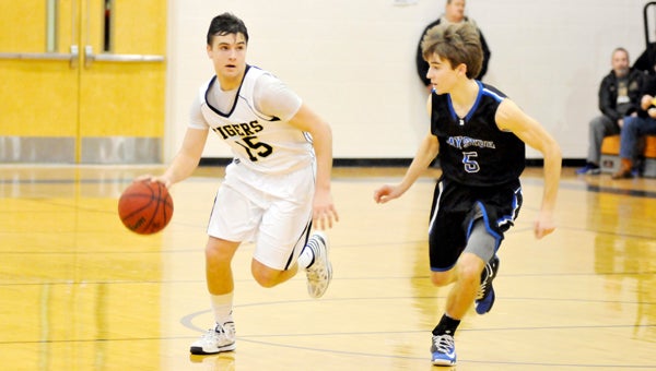 Straughn's Rollin Kinsaul advances down the court during the South Sub-Regional. | Andrew Garner/Star-News