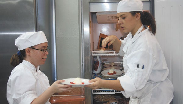 LBW culinary students Tiffany Burlison, left, and Amanda Bailey prepare desserts Thursday at the Andalusia campus.
