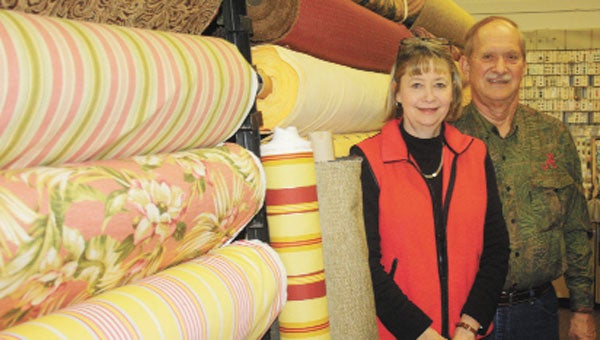 Singer owners David and Lisa McBrayer will soon move more than 2,000 rolls of drapery and upholstery across town to a new store location.