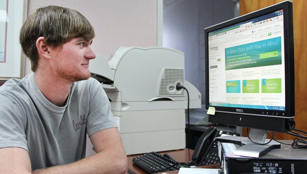 LBW Community College Industrial Electronics Student Garrett Montgomery of Brantley is pictured reviewing online information about a new tuition payment plan with National Business Solutions (NBS), available summer semester through a partnership with LBWCC. 