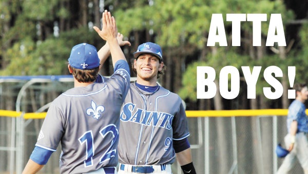 LBWCC’s Brandon Mayhann (9) high fives teammate Payne Wilson after the Saints posted a 9-6 game-two victory over Alabama Southern Friday afternoon. | Photos by Andrew Garner/Star-News