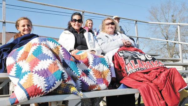 Brewton residents (left to right) Madeline Frazier, Patty Frazier and Tammy Elliott bundled up against the windy and cold weather in Opp Tuesday afternoon. All three were at the sports complex watching W.S. Neal play in the Butch Youmans Memorial Tournament.                    