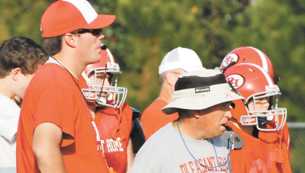 Cody McCain (left) has accepted a job as head football coach at Clements. His last day at Pleasant Home is April 11. McCain is shown here with former assistant coach Ron Yates at a fall practice. | Andrew Garner/Star-News 