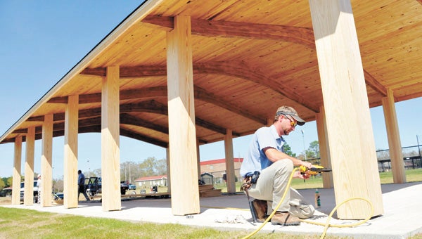 City of Andalusia employee Ray Ferguson works on the pavilion, which will be named in honor of the late Durrell “Duke” Smith, Monday afternoon. The dedication ceremony is Saturday at Johnson Park. | Andrew Garner/Star-News