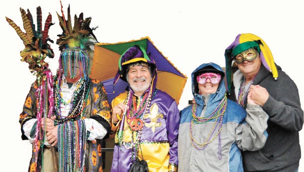 Members of the Krewe Lusia included William Gantt, Tommy Gerlach, Mimi and Dave Campbell. Below: The Campbells with Ron Pickron.     