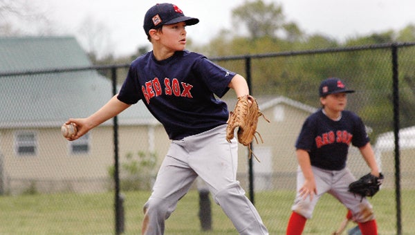 A pitcher for the rec league Red Sox in Andalusia winds up on opening day.