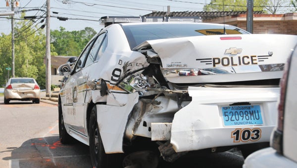 An Opp police cruiser was one of two vehicles struck Thursday morning by an Andalusia woman authorities say was driving under the influence. 