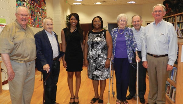 Shown from left are Robert Brown, Murray Findley, Perdue, her mom, Ronica Berry, Suan Riley Salter, Pete Donaldson and Jim Krudop. Perdue plans to attend the University of South Alabama. The foundation also gives its scholarship recipients an opportunity to participate in a study abroad experience during their college careers. 