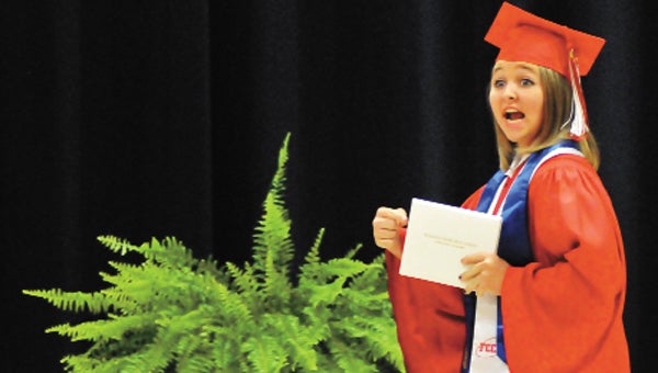 Pleasant Home’s Helena Weaver reacts to getting her diploma Thursday evening.  