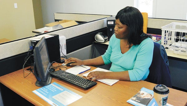 Tiwana Luckie works on a tax return Wednesday. 