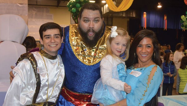 Ansley Cobb, 4, poses with the characters from Aladdin - John Reid McGlamory, Frank Shaffer, and Jennifer Botta.