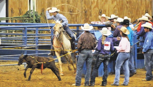 The Alabama High School Rodeo finals are under way at the Covington Arena. Local youth from around the county are competing against other rodeoers from throughout the state. The finals will continue through Saturday. The second go will begin at 9 a.m. today.   Above: Straughn’s Dustin Hyson attempts to rope a calf in the high school rodeo finals Thursday night. | Andrew Garner/Star-News