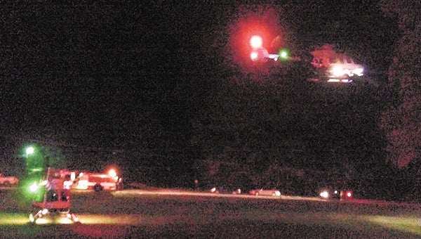 One of two helicopters takes off Tuesday night.