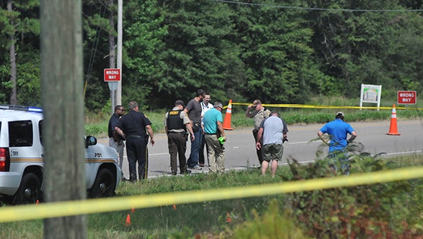 Law enforcement officials investigate the scene, where Opp officers were involved in a shooting earlier this afternoon. | Andrew Garner/Star-News