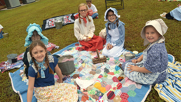 Fourth graders at Opp Elementary School dressed up in pioneer days attire and learned more about the era. Teachers and parent volunteers set up a pioneer classroom, taste of the west station, pioneer museum, corn shucker station, and more.