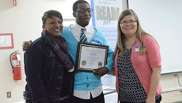 Latrece Hall and Kelley Nolan are shown with Jeffrey Hall, student of the year, at the  Covington County Committee on Employment of People with Disabilities luncheon. 