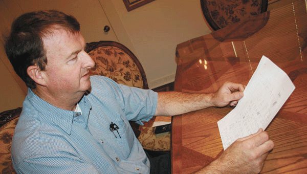 Joe Richburg reads a letter sent by a child. File photo