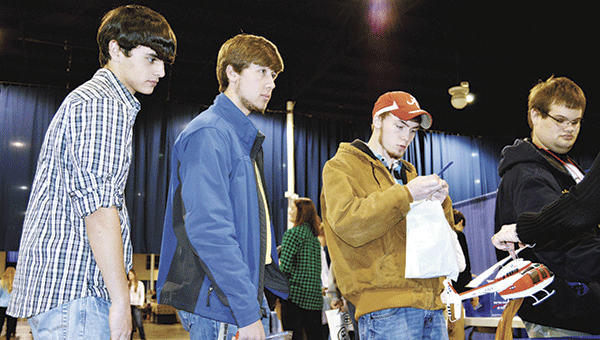 Local students check out an aerospace booth at the first career expo. File photo