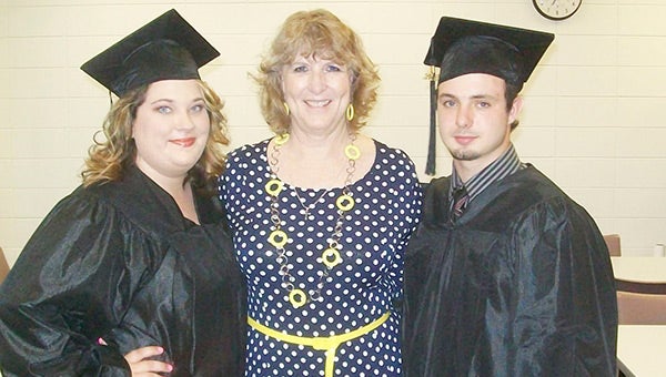 Ronda Ricks is shown with YES Program graduates Heather Sanders and Johnathan Cox. 