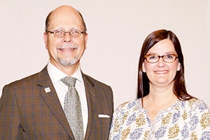 AHS graduate and LBWCC faculty member Christy McLelland Hutcheson and Dr. Herb Riedel, president. 