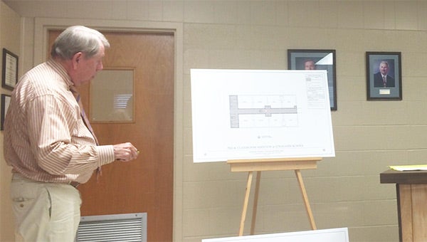 Architect Walter McKee discusses plans for a new addition at Straughn Elementary School. His plans call for two different options of adding in a storm shelter to the eight-room addition. Kendra Majors/Star-News