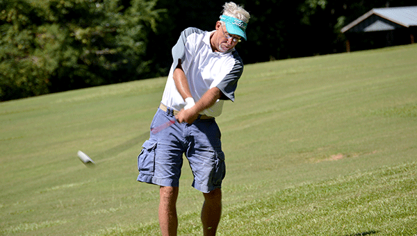 Lefty Tim Stewart puts a charge into the ball on the back nine. Josh Dutton/Star-News