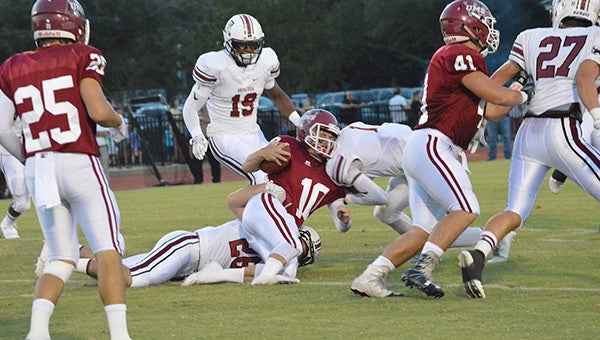 Riley Graham and Allan George put a hard hit on the UMS-Wright quarterback