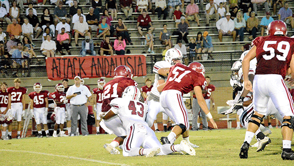Andalusia’s Ke’Shun Townsend puts a big lick on the UMS-Wright ball carrier in the back field on Friday night. Josh Dutton/Star-News