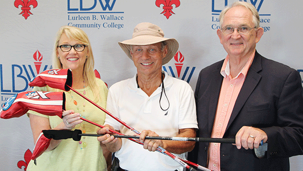 A “Hole in One” at the 2016 LBW Community College Foundation’s annual golf tournament earned Steve Barlow of Andalusia, center, a set of wood clubs, presented by Dr. Arlene Davis, left, tournament director, and Dr. Jim Krudop, LBWCC vice president. The “Hole in One” award was sponsored by Greenville Motor Company. Courtesy Photo