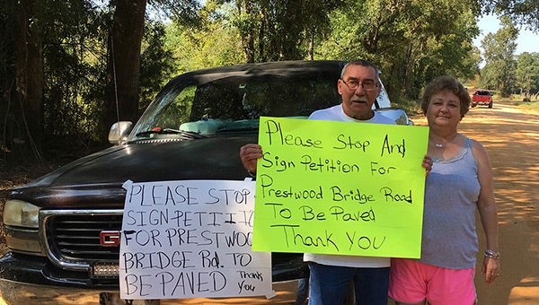 Theresa and Otis Richerson want the county to pave Prestwood Bridge Road. 